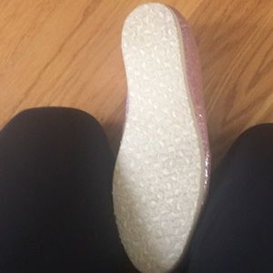 soles of sparkly pink toms